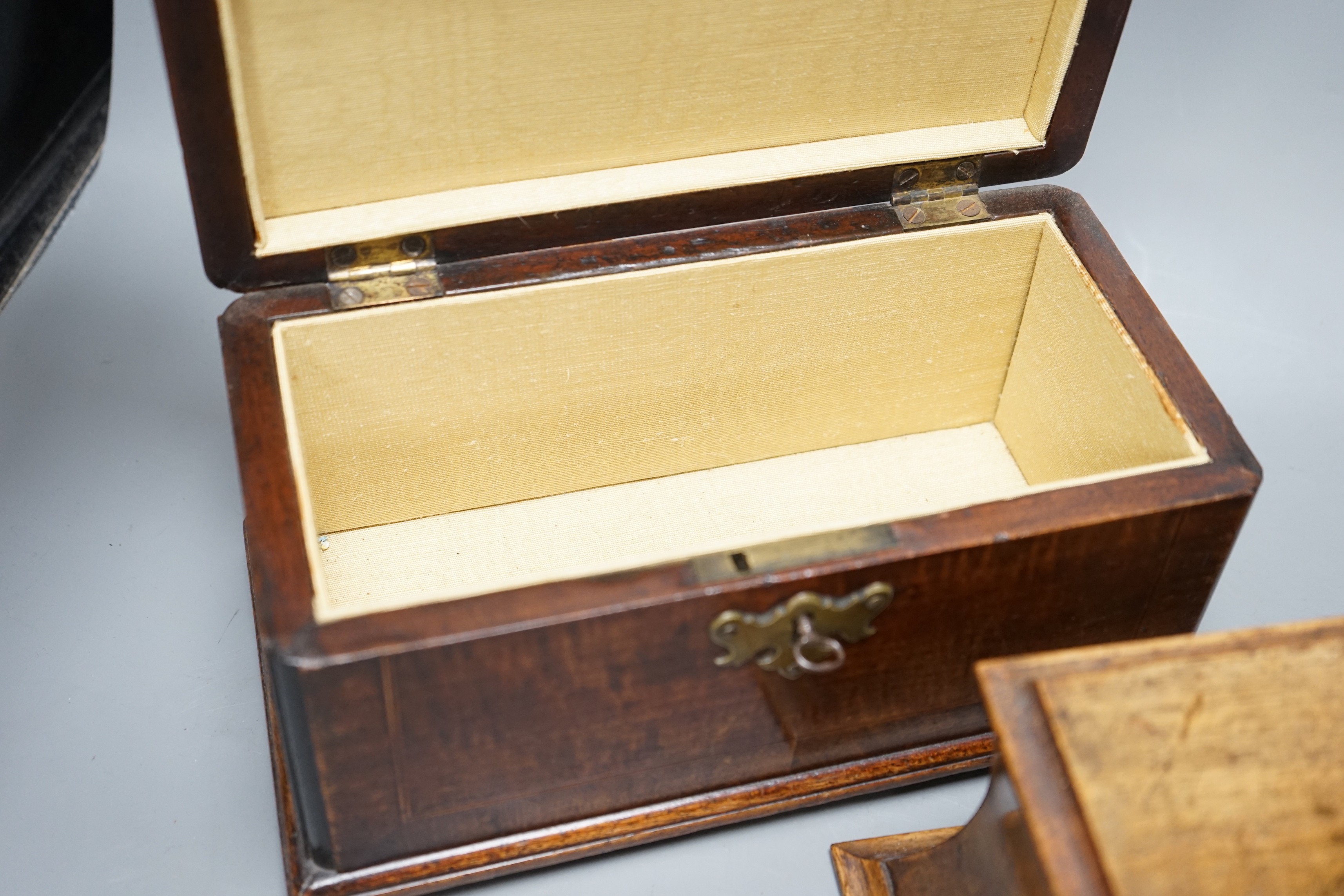 A George III mahogany tea caddy with inlaid decoration, together with a burr walnut veneer cavetto stationery box, both with keys